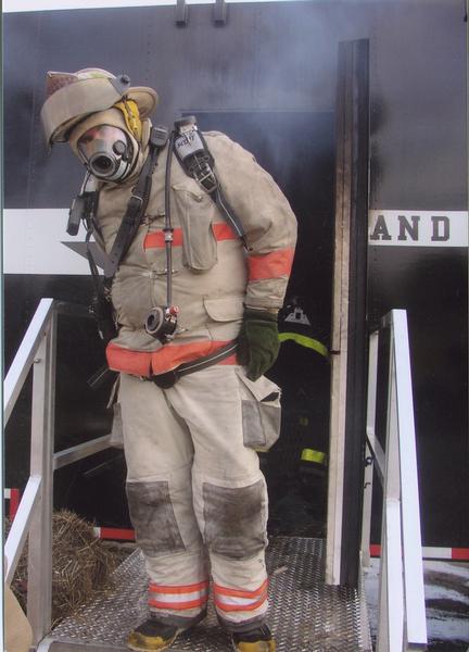 Assistant Chief Scott Harold in the Burn Trailer in 2003. 